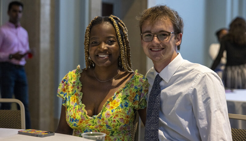 two students smiling for the camera