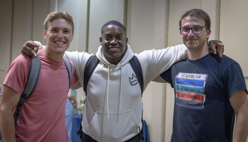 Three students posing for the camera