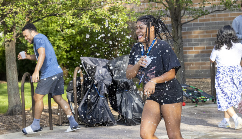 Students running in a water fight