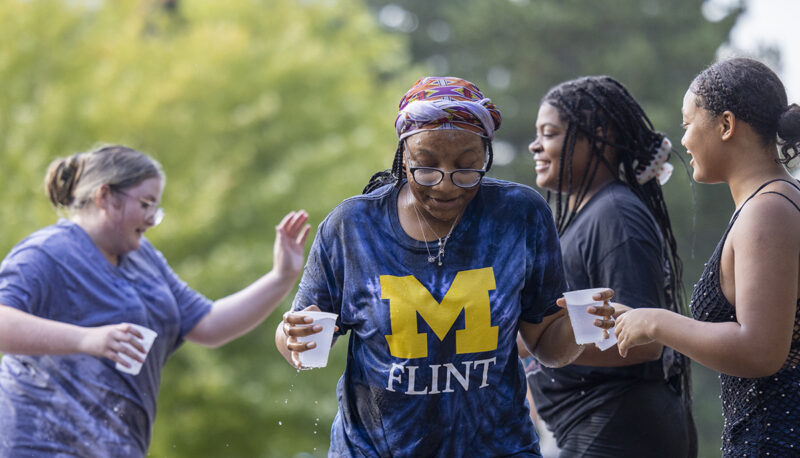 Group of students having a water fight