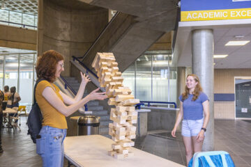 Students playing big jenga