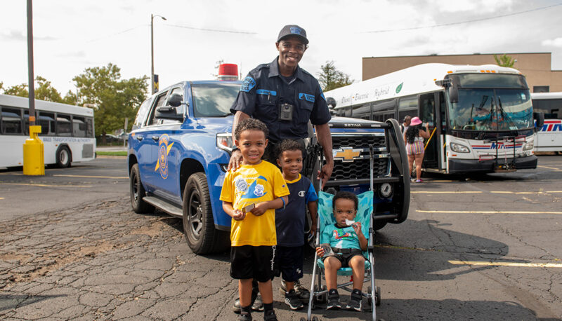 Michigan State Police posing with kids