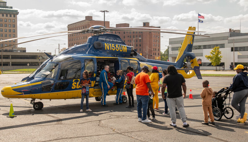 A line to see the Michigan Survival Flight helicopter