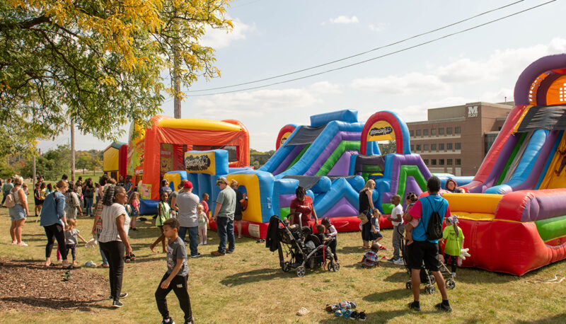 Kids playing on inflatable houses