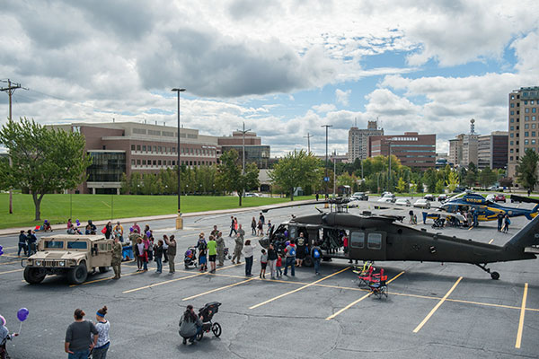 A view of the White Building parking lot with trucks and helicopters