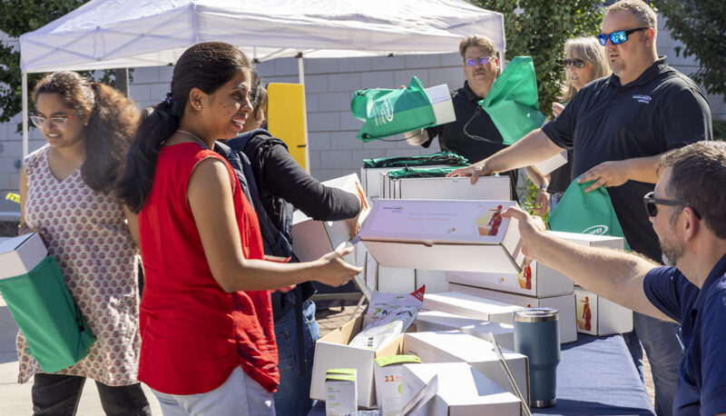 Volunteers handing out freebies at Eco Extravaganza