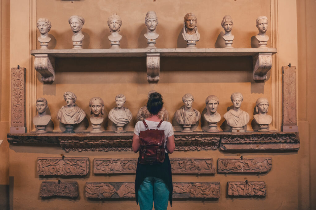 A museum curator examining the museum's collection.