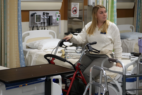 Occupational therapy student Kayla Gunn teaches other health care students safe patient handling techniques 