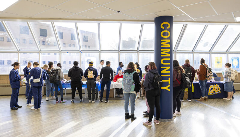 A wide shot of the group of people at the Stuff a Plush event