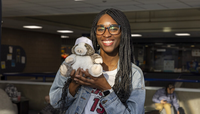 A student showing off her plushie