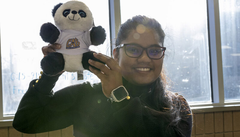 A student showing off her plushie