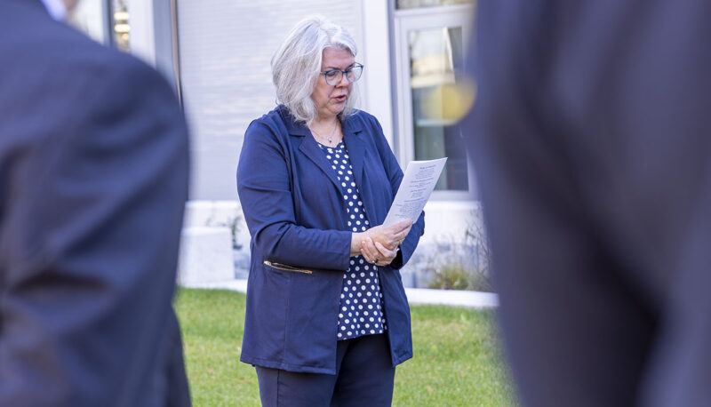 A woman speaking outside