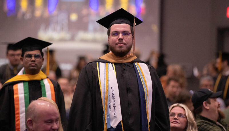 A student standing in a crowd