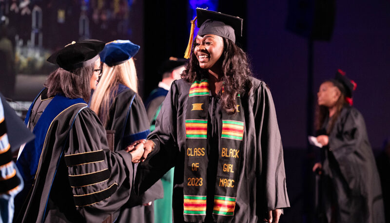 A student shaking hands