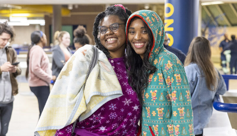 Students smiling during Late Night Breakfast