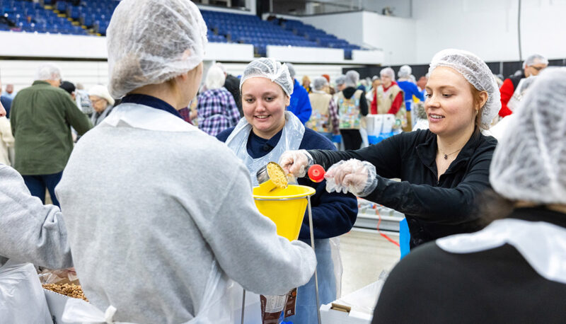 UM-Flint faculty and students putting meals together