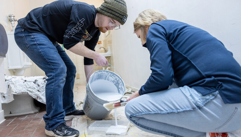 UM-Flint faculty and students pouring paint