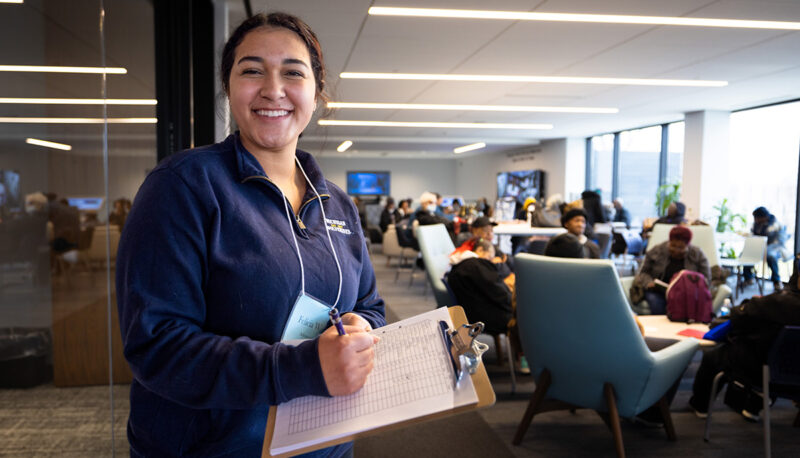 A female student smiling for the camera