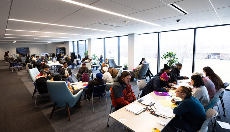 A room filled with people participating in the tax prep program