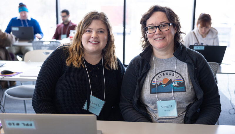 Two female students smiling for the camera