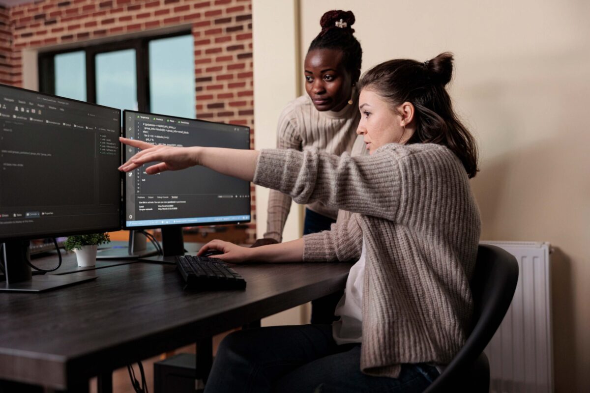 Two people looking at a computer screen