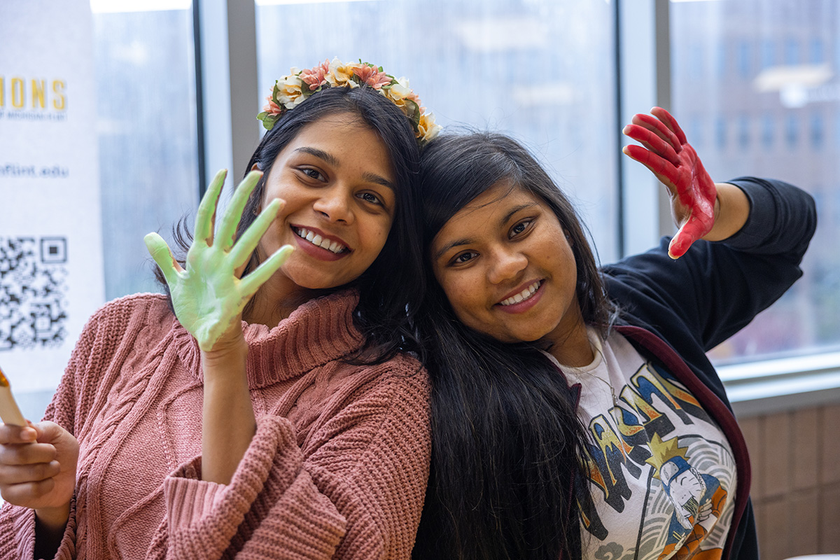 Two students showing off their painted hands