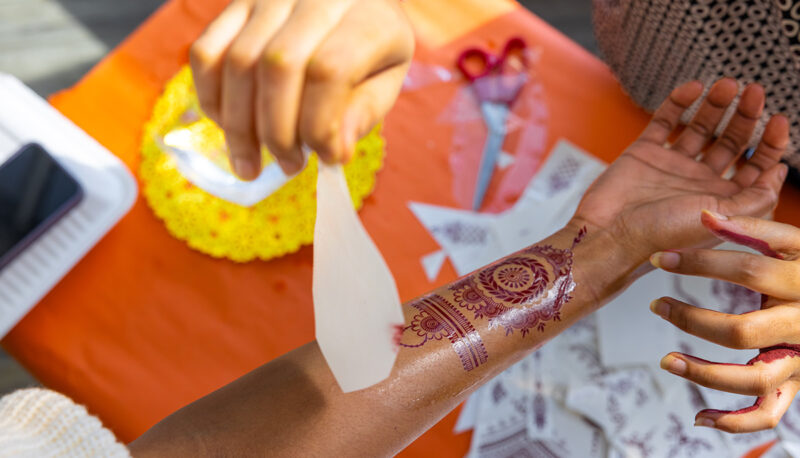 A henna tattoo being applied