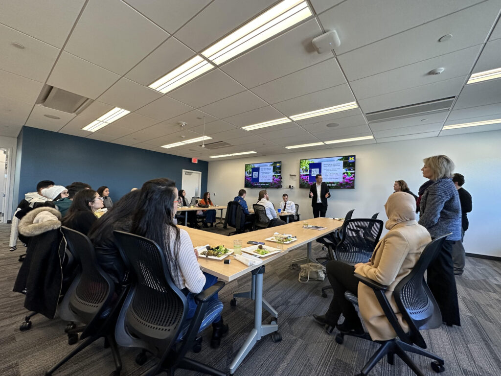 photo of conference room with speaker