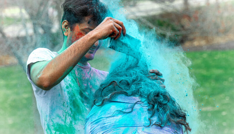 UM-Flint Holi celebration. During this celebration, students cover each other in colored paints as part of a traditional spring celebration.