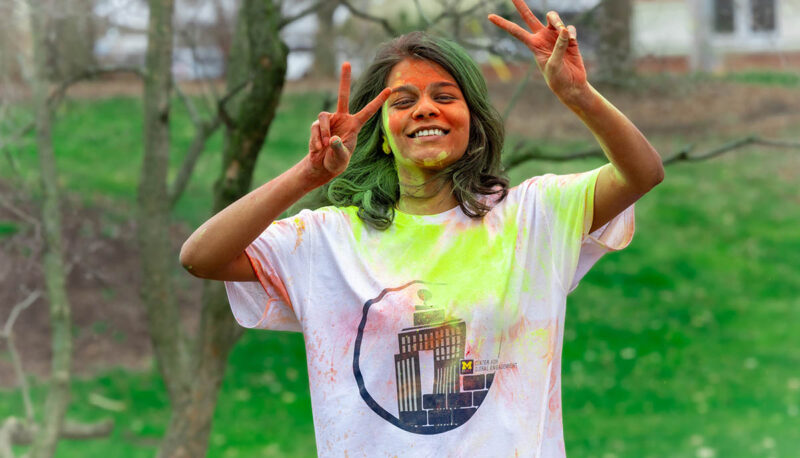 UM-Flint Holi celebration. During this celebration, students cover each other in colored paints as part of a traditional spring celebration.