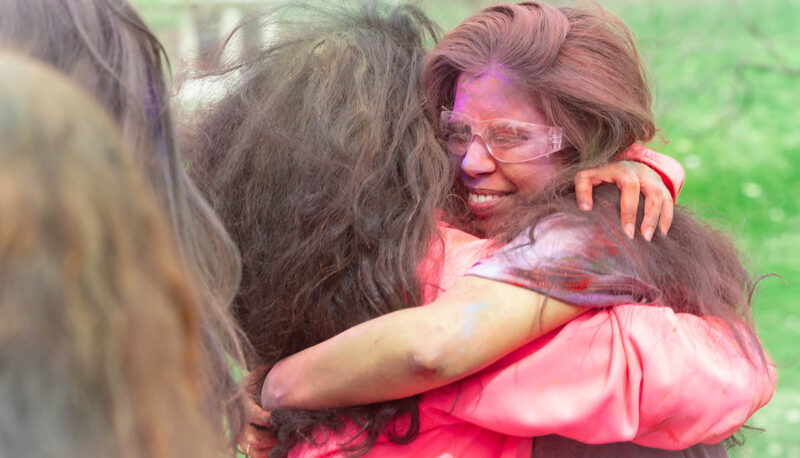 UM-Flint Holi celebration. During this celebration, students cover each other in colored paints as part of a traditional spring celebration.