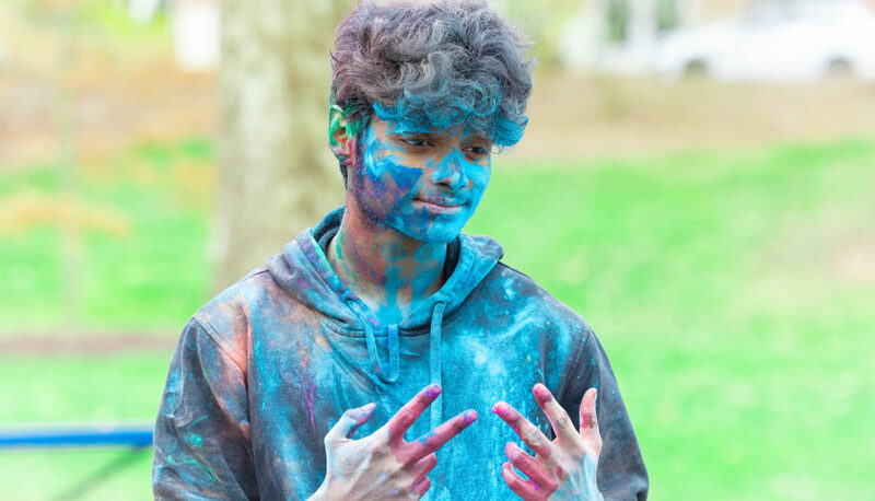 UM-Flint Holi celebration. During this celebration, students cover each other in colored paints as part of a traditional spring celebration.