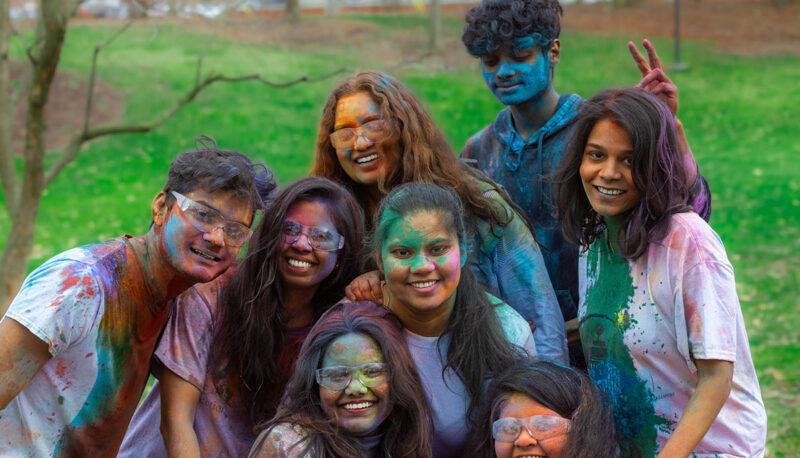 UM-Flint Holi celebration. During this celebration, students cover each other in colored paints as part of a traditional spring celebration.