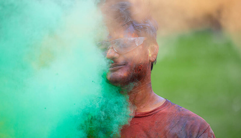 UM-Flint Holi celebration. During this celebration, students cover each other in colored paints as part of a traditional spring celebration.