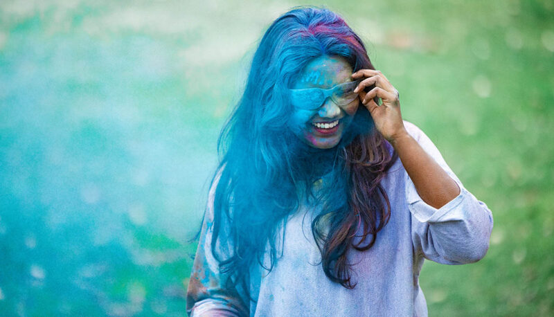 UM-Flint Holi celebration. During this celebration, students cover each other in colored paints as part of a traditional spring celebration.