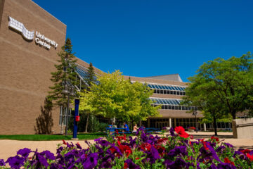 exterior of University Center with flowers