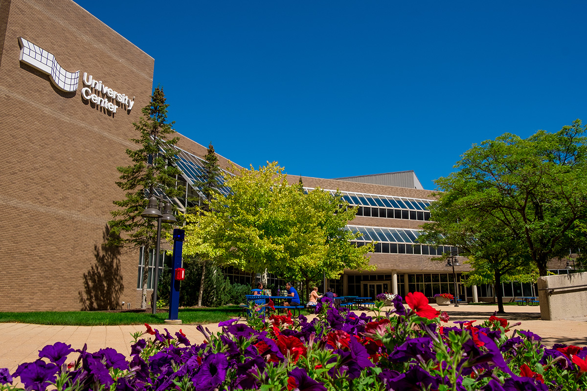 exterior of University Center with flowers