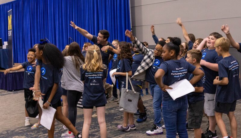 Nic Custer (UM-Flint staffer) getting Young Sharks participants ready for the day.