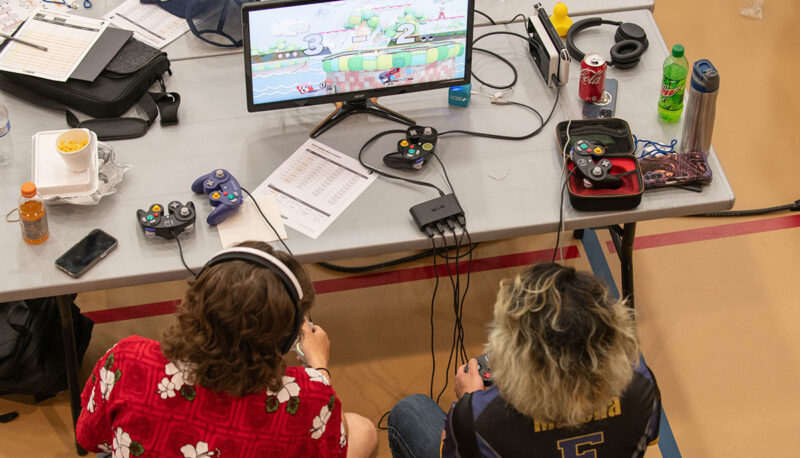 An overhead shot of two competitors playing a video game.