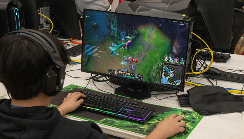 A competitor using a mouse and keyboard while playing a game