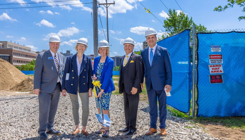 A group posing with the ceremonial shovel. From left to right: Christopher Pearson, Mott Foundation Program Director Kimberly Roberson, Donna Fry, Sheldon Neeley, Mike Behm