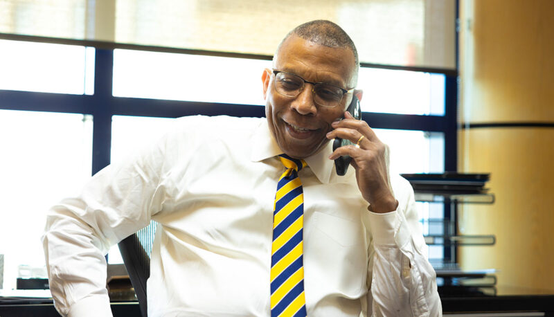 Chancellor Alexander speaking on the phone.