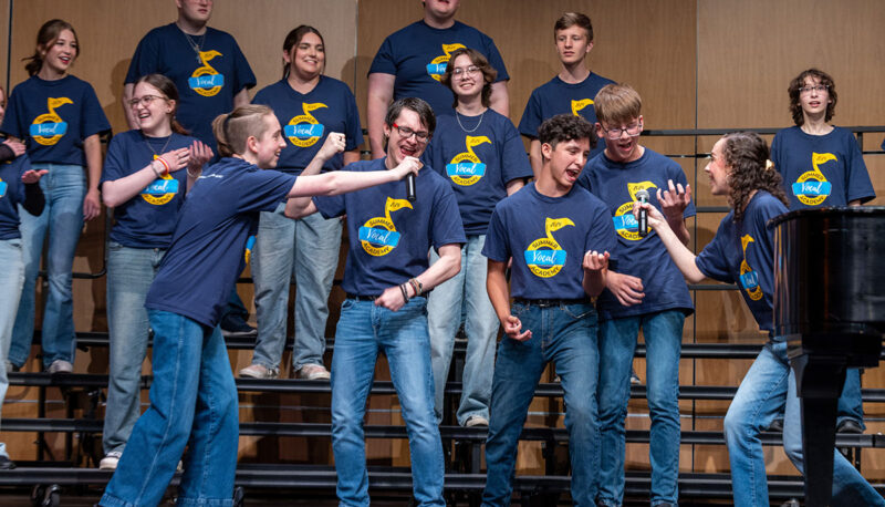 Campers performing on stage.