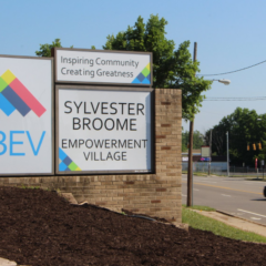 The Sylvester Broome Empowerment Village sign in front of their location in Flint