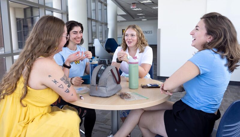 A table of students in the White Building