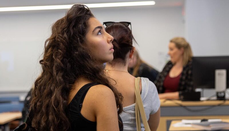 A student looking up at the board.