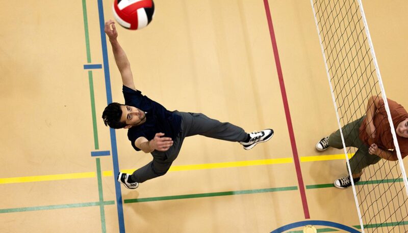 An overhead view of a student hitting a volleyball.