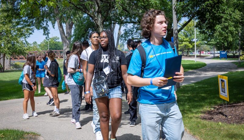 Students walking outside on campus.