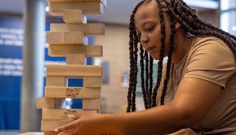 A student playing giant Jenga