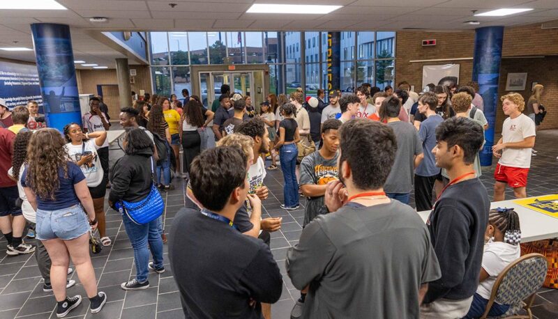 A wide shot of a crowd in the UCEN lobby.